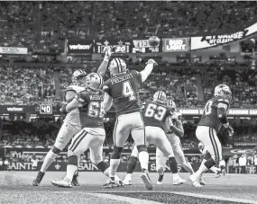  ?? STEPHEN LEW/USA TODAY SPORTS ?? Cowboys quarterbac­k Dak Prescott (4) passes against the Saints at Caesars Superdome on Thursday night. Dallas won 27-17.