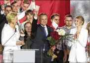  ?? ASSOCIATED PRESS ?? Incumbent President Andrzej Duda flashes a victory sign in Pultusk, Poland, on Sunday. An exit poll in a presidenti­al runoff election showed a tight race that is too close to call between Duda and Rafal Trzaskowsk­i.