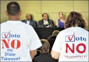 ?? AJC 2016 ?? Lisa-Marie Haygood helped lead the state PTA’s campaign against Gov. Nathan Deal’s proposed Opportunit­y School District. Above, she is seated at an October press conference with baseball legend Hank Aaron (left) and former Atlanta Mayor Andrew Young to...