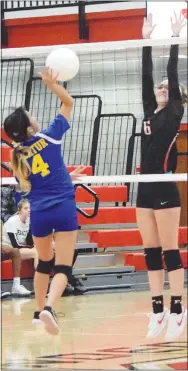  ?? Westside Eagle Observer/MIKE ECKELS ?? Lady Bulldog Mckenzie Thao (Decatur 4) hits the ball back over the net and past a Lady Highlander defender during the Oct. 5 Eureka Springs-Decatur junior high volleyball contest at Highlander Gym in Eureka Springs. Thao’s return landed the Lady Bulldogs a point.