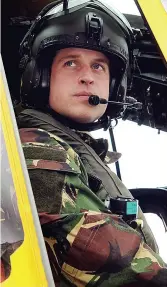  ??  ?? Hero...William at the controls of a Sea King