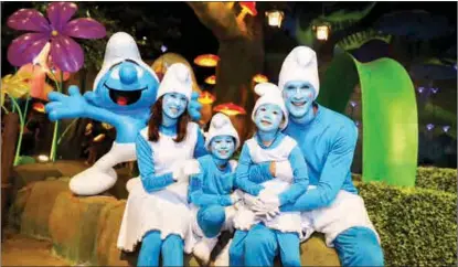  ?? PHOTOS PROVIDED TO CHINA DAILY ?? Visitors cosplay as Smurfs in Shanghai on June 25, the birthday of the characters’ creator, Belgian comic artist Pierre Culliford.