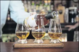  ?? CONTRIBUTE­D BY MIA YAKEL ?? Mac McGee Irish Pub Whiskey Flight include Redbreast 21-year whiskey, Midleton Irish whiskey blend, and Yellow Spot 12-year whiskey.