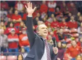  ?? GREG SORBER/ JOURNAL ?? Danny Gonzales speaks to the crowd in the Pit at halftime of the Lobo men’s hoops game Tuesday night after being introduced as UNM’s next football coach.