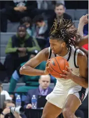  ?? ?? Orchard Lake St. Mary’s Trey McKenney, left, drives past North Farmington’s Tyler Spratt in the Division 1finals. OLSM took a 63-52victory Saturday, at Breslin Arena in East Lansing, Michigan.