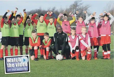  ??  ?? Former Sunderland captain Gary Bennett with some of the players taking part in a football competitio­n at Silksworth Sports Complex.