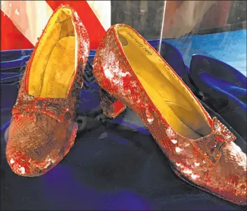  ?? Jeff Baenen The Associated Press file ?? Ruby slippers worn by Judy Garland in the “The Wizard of Oz” and stolen from a Minnesota museum in 2005 are displayed in 2018 after being recovered by the FBI.