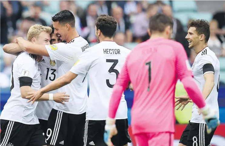  ?? — GETTY IMAGES ?? German players celebrate midfielder Lars Stindl’s opening goal at the Confederat­ions Cup against Australia in Sochi, Russia, on Monday. The Germans won 3-2.