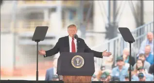  ?? Scott Olson / Getty Images ?? President Donald Trump speaks to guests during a visit to the Southeast Iowa Renewable Energy ethanol facility on Tuesday in Council Bluffs, Iowa.