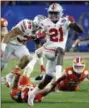  ?? ASSOCIATED PRESS FILE ?? Ohio State wide receiver Parris Campbell escapes the reach of Clemson linebacker Chad Smith during the Fiesta Bowl on Dec. 31.