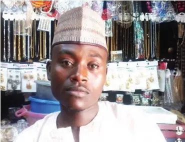  ??  ?? Ahmed Kabir runs a jewellery shop that also offers other items for sale. He says prices of some items have gone down PHOTOS: Nathaniel Bivan
