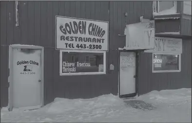  ?? Photo by RB Smith ?? MOST IMPACTED— Restaurant­s and bars in Nome are amongs the most impacted businesses by the pandemic. Golden China is closed, Husky Restaurant next door is open for take-out only.