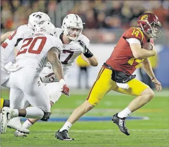  ?? [MARCIO JOSE SANCHEZ/THE ASSOCIATED PRESS] ?? USC quarterbac­k Sam Darnold scrambles against Stanford during the first half of the Pac-12 championsh­ip game.