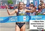  ?? ?? > Olivia Tsim comes home as first woman finisher