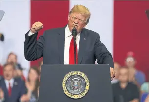  ?? JUSTIN SULLIVAN/GETTY IMAGES ?? President Donald Trump speaks to supporters during a Make America Great Again campaign rally in Fargo, N.D. Trump continued his criticism of Canada and Prime Minister Justin Trudeau.