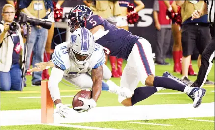  ??  ?? Detroit Lions defensive back Will Harris (43) dives to score a touchdown after recovering a fumble as Houston Texans quarterbac­k Joe Webb III (5) tackles
him during the first half of an NFL preseason football game on Aug 17 in Houston. (AP)