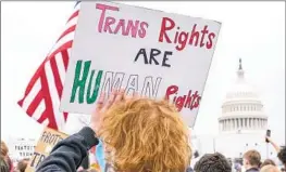  ?? Jacquelyn Martin Associated Press ?? PEOPLE RALLY outside the U.S. Capitol as part of Transgende­r Day of Visibility on March 31, 2023. The Supreme Court may join the transgende­r care debate.