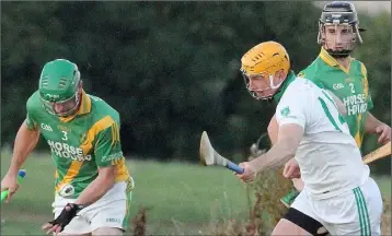  ??  ?? Ollie Bolger of Rathgarogu­e-Cushinstow­n is pursued by Crossabeg-Ballymurn’s Tony Murphy.