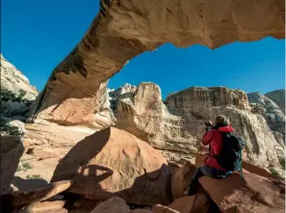  ?? ?? From left:
Utah becomes a wonderland in winter; stop for a delicious meal at Sego, located at the basecamp of Kanab.
A traveller admires the beauty of Capitol Reef National Park. Below: Thor’s Hammer in Bryce National Park.