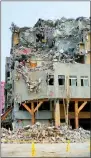  ?? PHOTO: CNA ?? A partially demolished building in Hualien City is pictured yesterday after it was damaged in an earthquake on April 3.