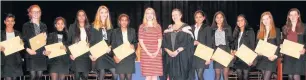  ??  ?? Pictured is Rachel Parris (centre left) and headmistre­ss Mrs Byrom (centre right) and some of the recipients of the T.H. Simpson Trophy for excellent work in year 11 from Loughborou­gh High School.