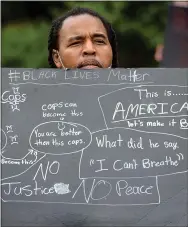  ?? PHOTOS BY PETE BANNAN - MEDIANEWS GROUP ?? Khaleo Smith of West Chester listens during speeches at the rally to support Black Lives Matter at the historic Chester County Courthouse on Saturday morning.