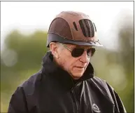  ?? Rob Carr / TNS ?? Hall of Fame trainer D. Wayne Lukas looks on as his horse Ram trains on the track on May 12, 2021, for the Preakness Stakes at Pimlico Race Course.