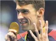  ?? Lee Jin-man / Associated Press 2016 ?? Michael Phelps will win zero medals, as he is retired. His 28 Olympic medals are the most ever.