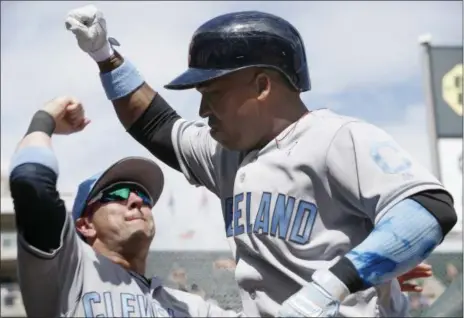  ?? JIM MONE — ASSOCIATED PRESS ?? Jose Ramirez is congratula­ted as he enters the dugout following his solo home run off Twins relief pitcher Alex Wimmers on June 17.