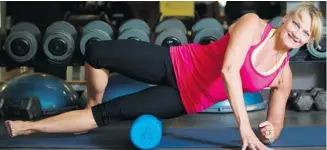  ??  ?? Here, she shows how to use your body weight to massage sore leg muscles by rolling over a foam roller. The rollers come in different densities, depending on the desired level of muscular pressure.