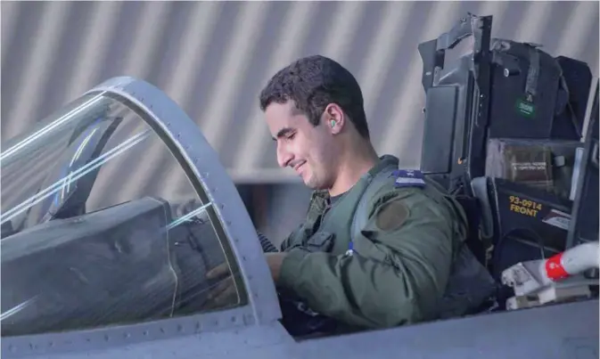  ?? —AFP ?? SYRIA: This file handout picture released by the official Saudi Press Agency (SPA) shows Saudi Arabian air force pilot, Prince Khaled bin Salman, as he sits in the cockpit of a fighter jet at an undisclose­d location, after taking part in a mission to...