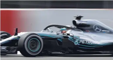  ??  ?? Mercedes driver Lewis Hamilton steers his car during the Spanish Formula One Grand Prix at the Barcelona Catalunya racetrack in Montmelo, Spain, on May 13, 2018.