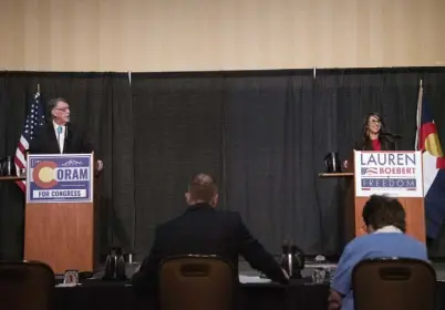  ?? Photos by William Woody, Special to The Denver Post ?? State Sen. Don Coram and Republican U.S. Rep. Lauren Boebert debate at the Sky Ute Casino Resort in Ignacio on Thursday.