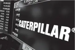  ?? Associated Press ?? ■ The logo for Caterpilla­r appears above a trading post April 23 on the floor of the New York Stock Exchange. Fears of a trade war have given a boost to some of the biggest companies in the market as well as the smallest, but they’ve squeezed almost...