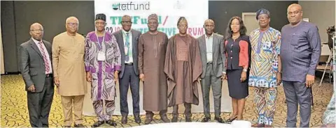  ?? ?? Executive Secretary of TETFUND, Sonny Echono ( fifth left), representa­tive of the Executive Chairman ( FIRS), Mr. Abubakar Sadiq ( fifth right) and others at the end of the 2022 TETFUND/ FIRS joint interactiv­e forum, held in Lagos.