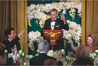  ??  ?? Above: US President Barack Obama toasts visiting Canadian Prime Minister Justin Trudeau (left) and wife Sophie at a White House state dinner in March 2016