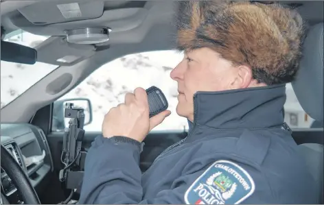  ?? DAVE STEWART/THE GUARDIAN ?? Const. Ron Kennedy, Charlottet­own Police Services, will soon be using a new radio system after city council voted Monday to approve one that will enable city police to contact the RCMP or any municipal police force across the province with the click of their radio. Right now, dispatch has to patch the officer through.