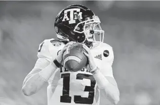  ?? Michael Reaves / Getty Images ?? Based on playing time last year, redshirt freshman Haynes King has an edge in the quarterbac­k battle at Texas A&M, but coach Jimbo Fisher says Zach Calzada and Eli Stowers are in the mix.