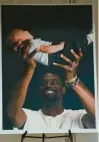  ?? COURTESY ?? A photograph of Tyre Nichols holding his child sits in the foyer of Mississipp­i Boulevard Christian Church on Wednesday in Memphis, Tennessee. Nichols was killed by Memphis police officers on Jan. 7.