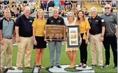  ??  ?? Pictured are, from left,: Board Secretary Tony Swink, Board Member David Scoggins, Vice Chair Rhoda Washington, Coach Hal Lamb, Kim Lamb, Superinten­dent Michele Taylor, Chairman Eddie Reeves and Board Member Andy Baxter.