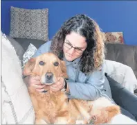  ?? LYNN CURWIN/TRURO DAILY NEWS ?? Lori MacWha comforts her dog Kira, who is recovering from Lyme disease.