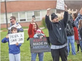  ?? MYKAL MCELDOWNEY / THE INDIANAPOL­IS STAR ?? Employees of Rexnord Corp. in Indianapol­is and family members protest on Nov. 11 against the company's decision to move 350 jobs to Mexico.