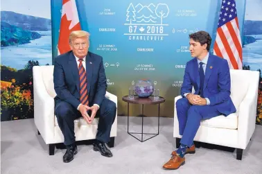  ?? EVAN VUCCI/ASSOCIATED PRESS ?? President Donald Trump meets with Canadian Prime Minister Justin Trudeau during the G-7 summit, on Friday, in Charlevoix, Canada.