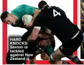  ?? ?? HARD KNOCKS: Sexton is tackled against New Zealand