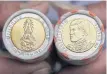  ??  ?? Banknotes and coins depicting HM the King are shown as the first series of the banknotes with three denominati­ons and coins with six denominati­ons went into circulatio­n on Chakri Memorial Day yesterday.