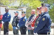  ?? Zach edmondson ?? Thomas Stenzel, a Vietnam veteran and resident of Kennesaw, stands with other veterans watching as the interment ceremony for six Vietnam veterans proceeds .