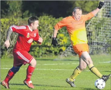  ?? Pictures: Gary Browne FM4996874 ?? Dirk Rondout takes the ball on for Master Brewer against Aldington