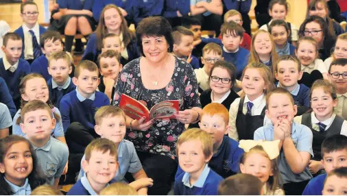  ??  ?? New chapter Award-winning author Linda Strachan reads to her captivated young audience from Spittal Primary