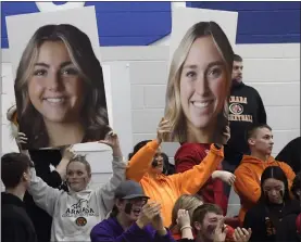  ?? ?? Armada fans hold out cutouts of their favorite players’ faces.