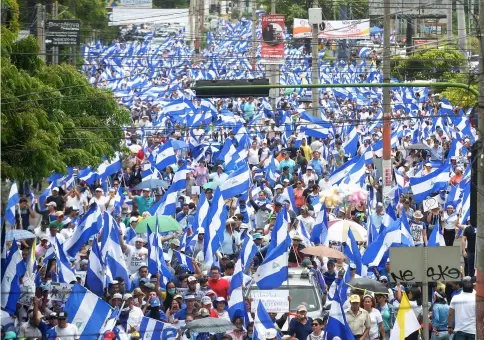  ??  ?? Nicaraguan opposition demonstrat­ors take part in a nationwide march called ‘United we are a volcano’ in Managua. — AFP photo